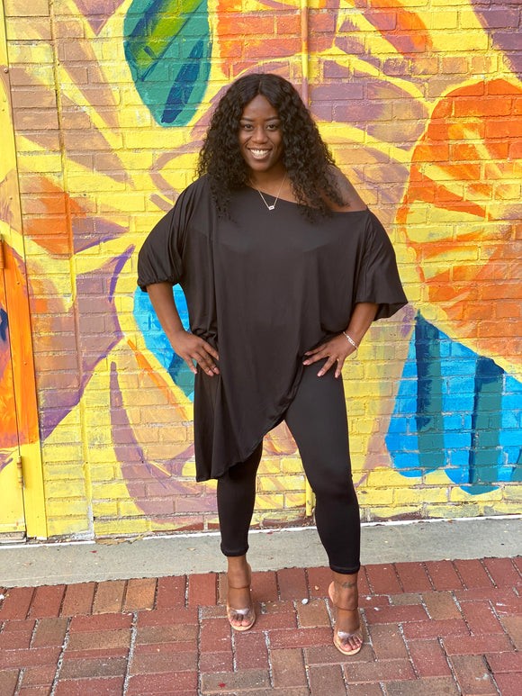 women wearing a black 2 piece set with an optional off the shoulder top and stretchy leggings