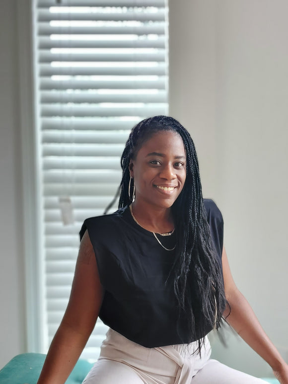 women wearing black sleeveless top with shoulder pads