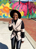 woman laughing wearing a Cream and Black Color  Blocked Belted Wrap  Jacket with  Belt Strap Buckle details on both arms